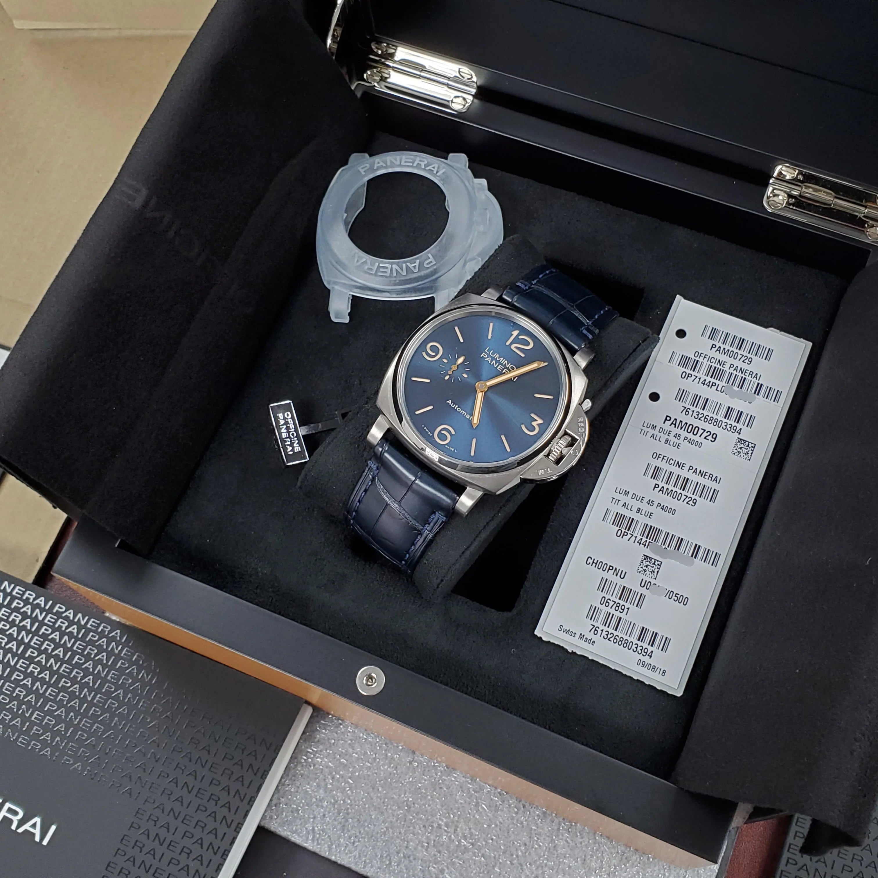 Panerai watch in a display case with branding visible