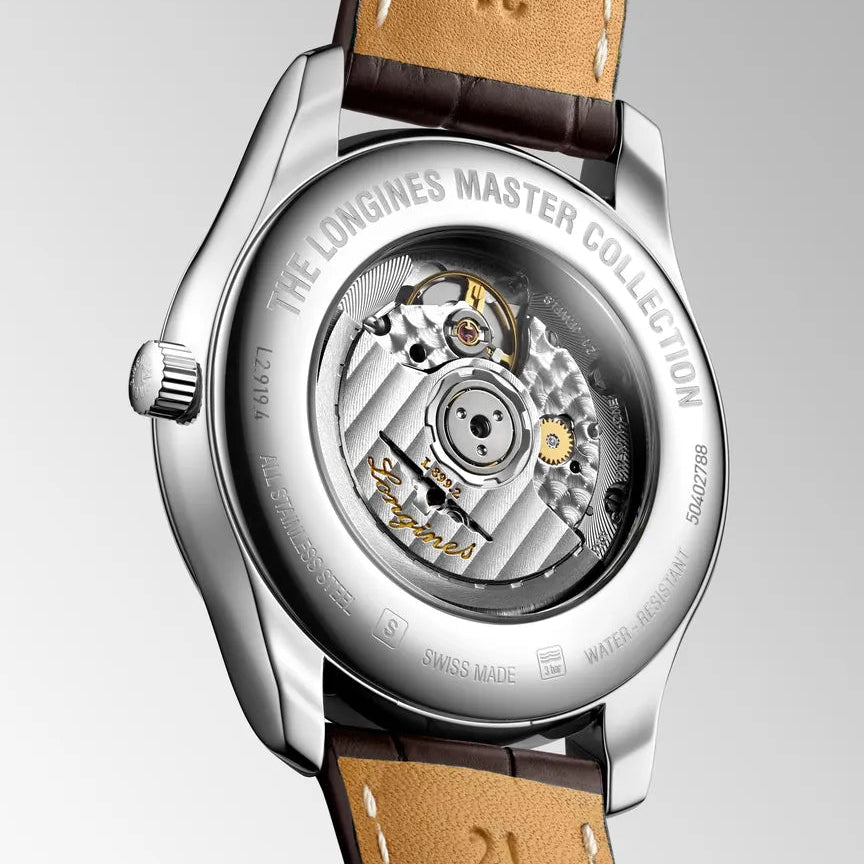 Watch with brown leather strap and visible mechanical components on a gray background