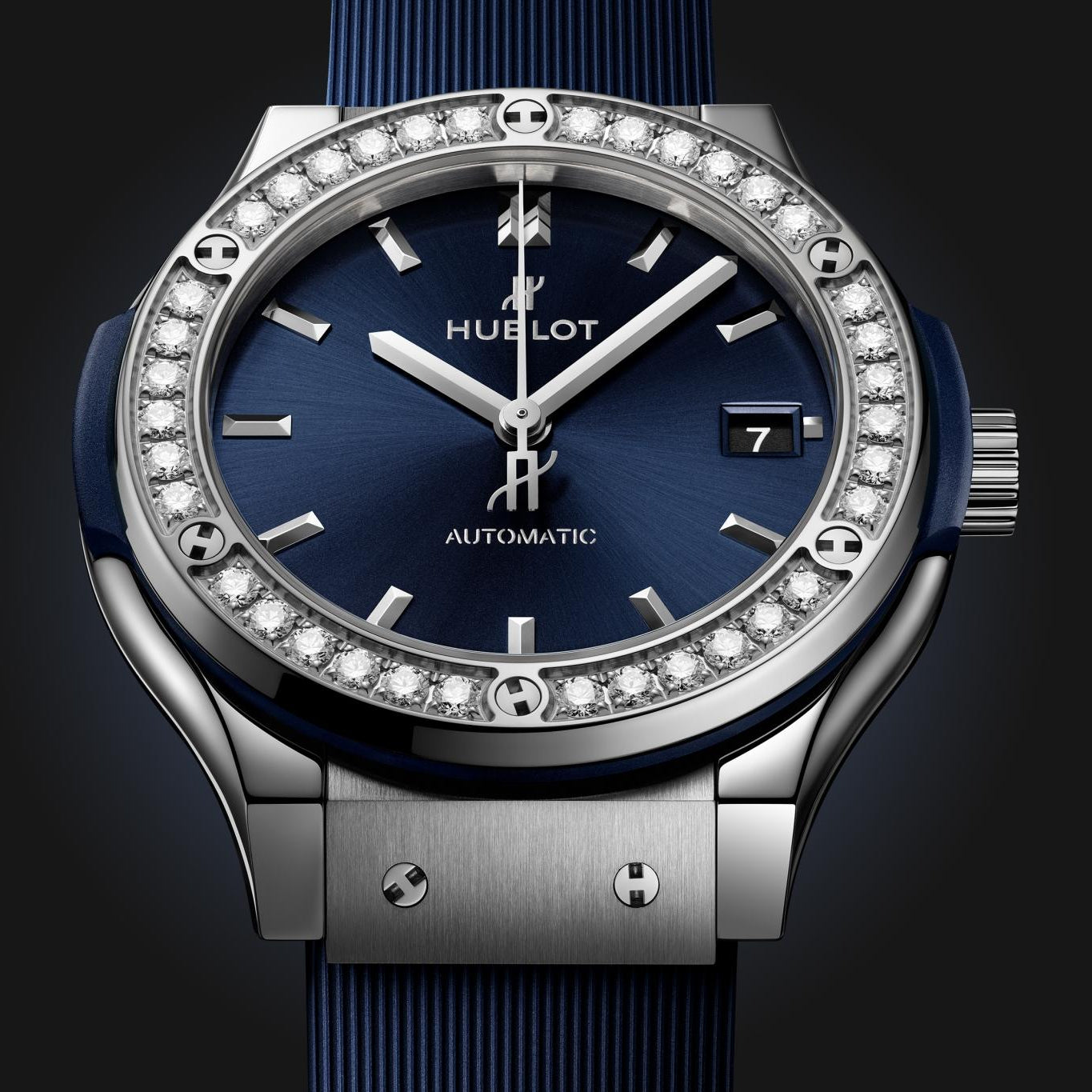 Hublot watch with blue face and strap on a dark background