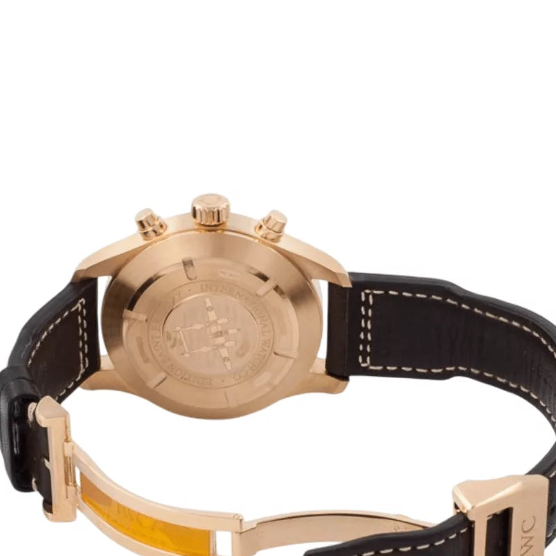 Rose gold watch with black leather strap on a white background