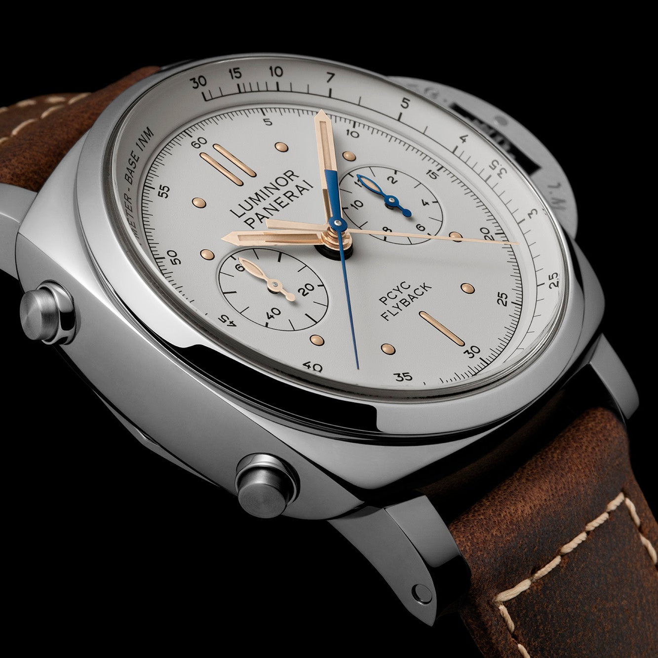 Luxury wristwatch with brown leather strap and silver case on a black background