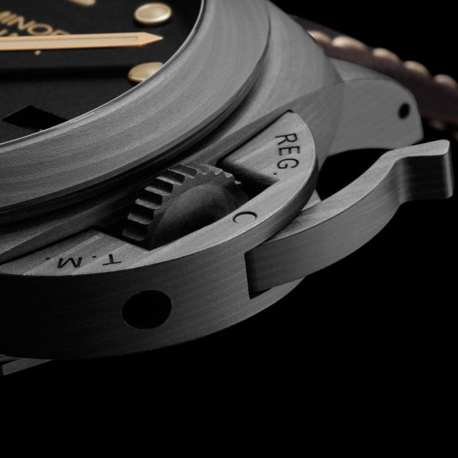 Close-up of a Panerai Luminor watch with detailed case and brand name.