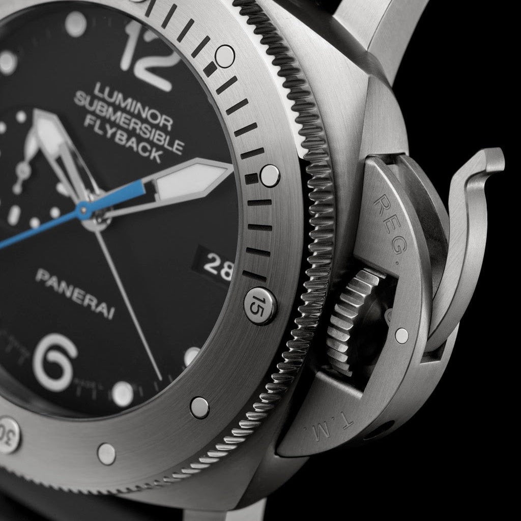 Panerai Luminor Submersible Flyback watch with black dial and silver case on a black background