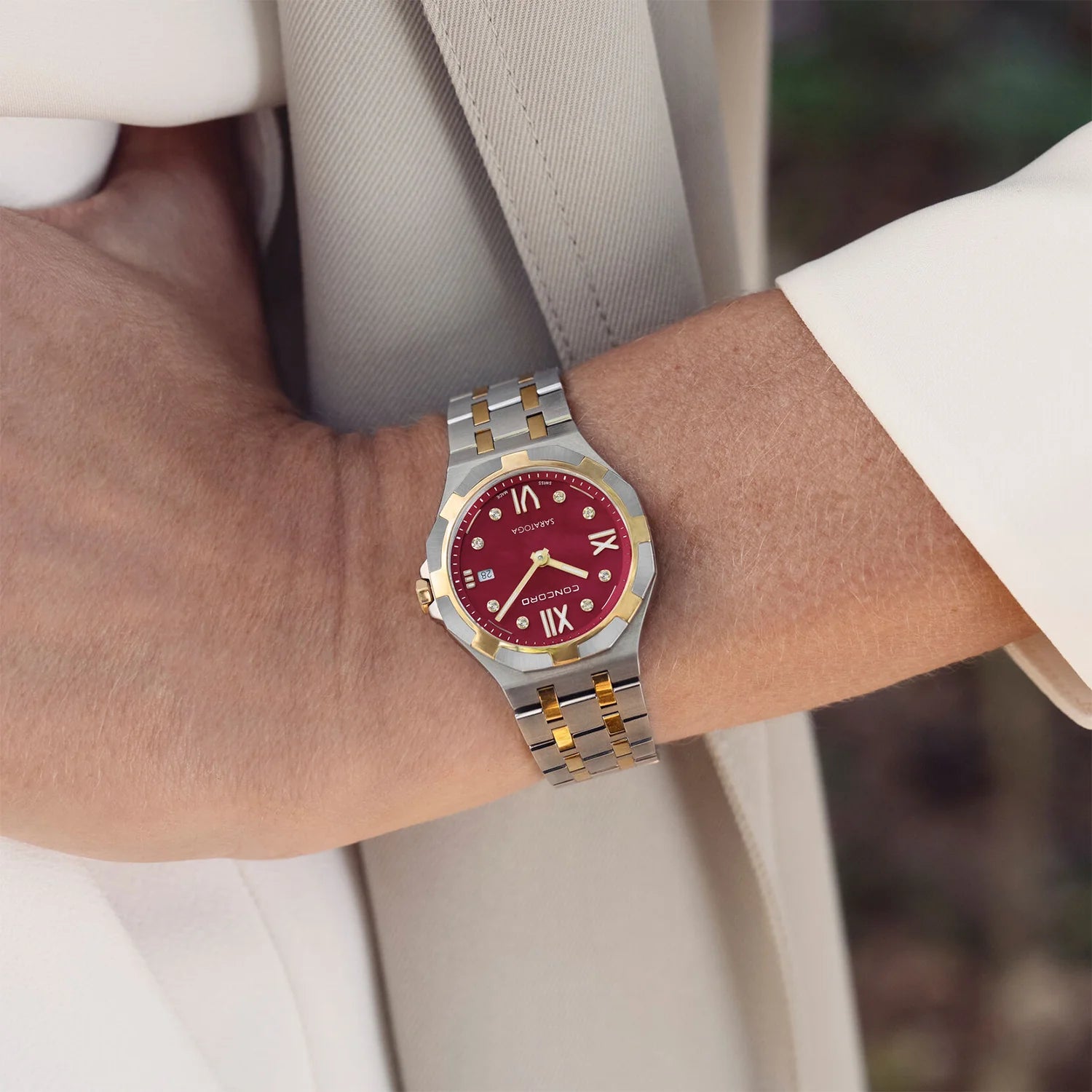 CONCORD WOMEN'S SILVER & GOLD TONE CASE RED MOP DIAL QUARTZ WATCH