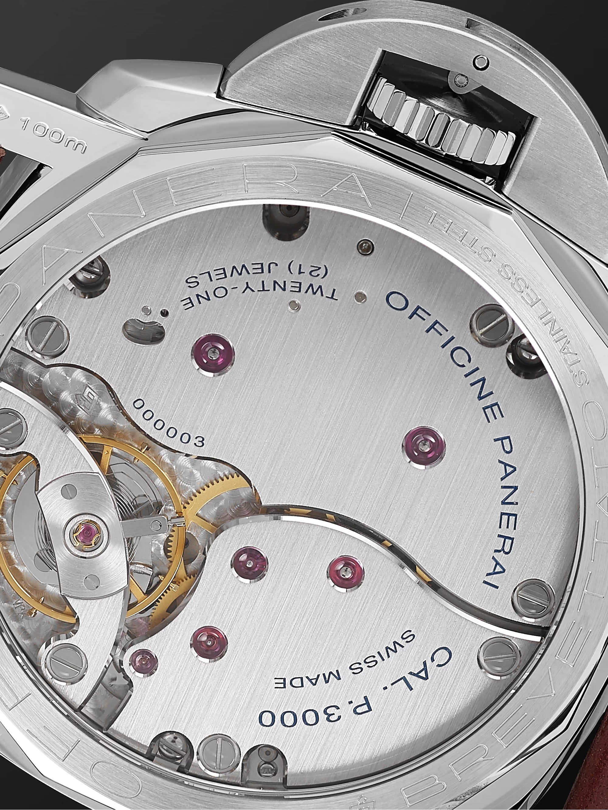 Close-up of a Panerai watch mechanism with 'Officine Panerai' branding.