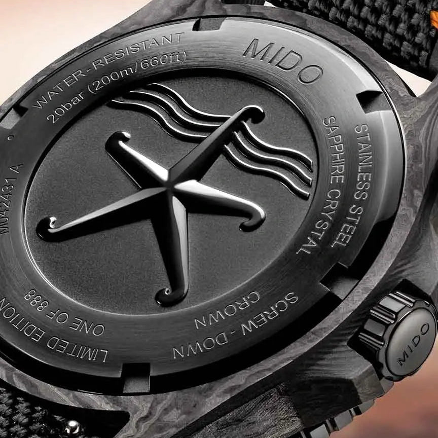 Close-up of a Mido watch with detailed branding and design elements.