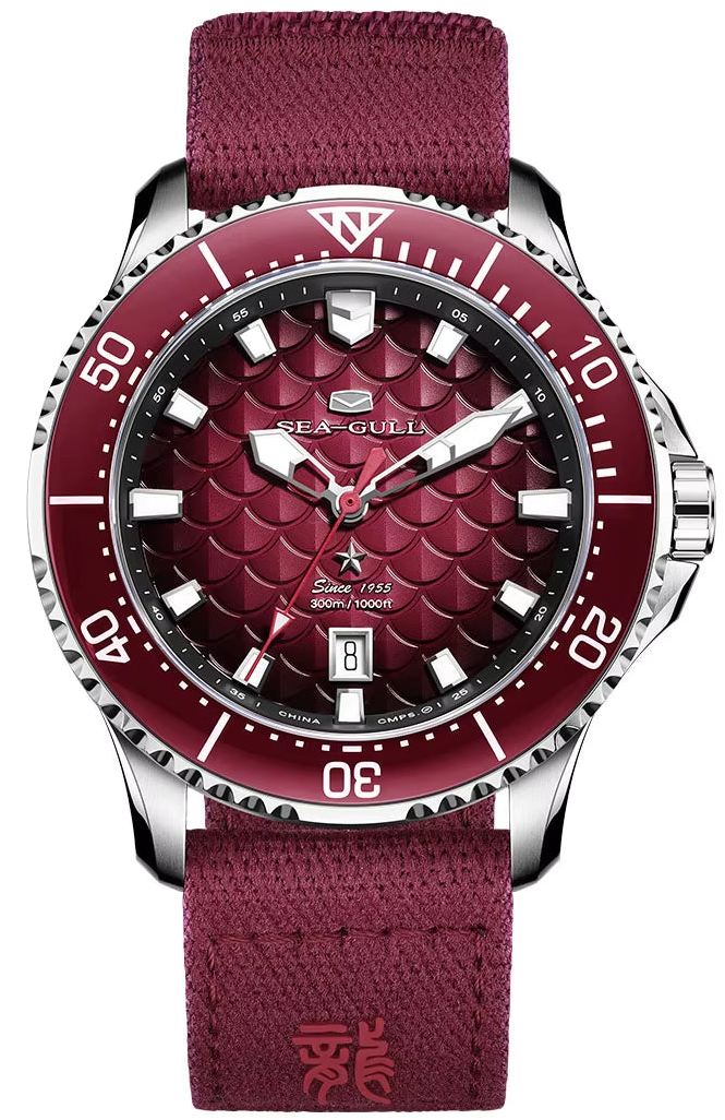 Red watch with detailed face and matching strap on a white background