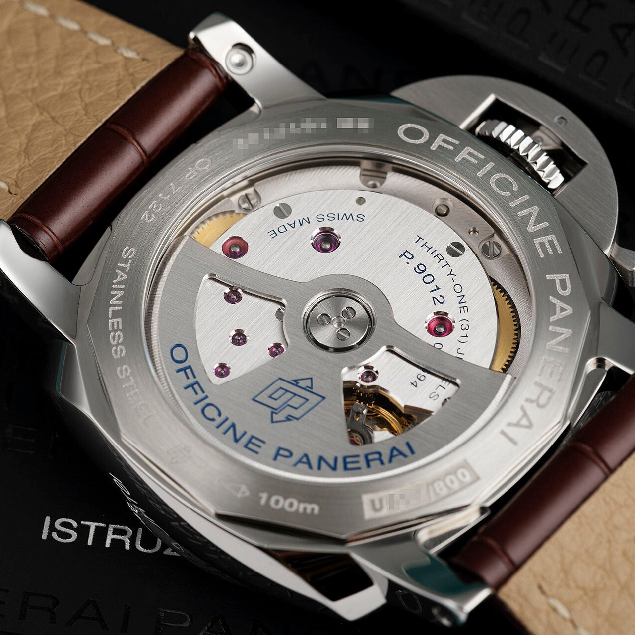 Close-up of a Panerai watch with visible brand name and intricate design.