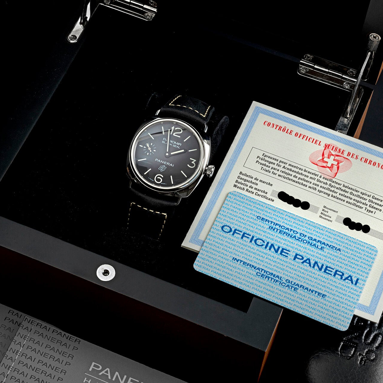 Panerai watch with certificate on a black background